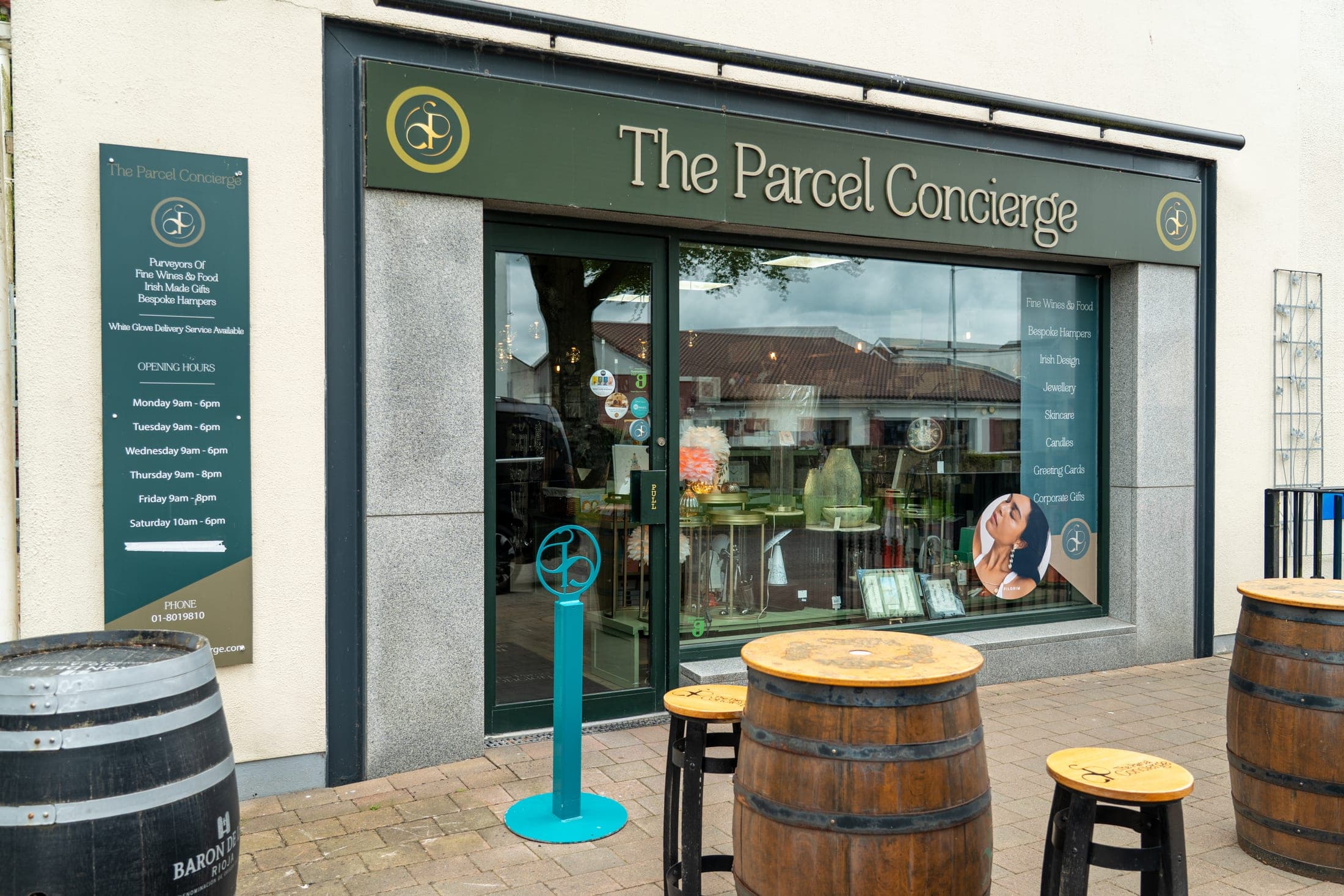 The Parcel Concierge shopfront in Dunshaughlin, with wine barrel tables outside